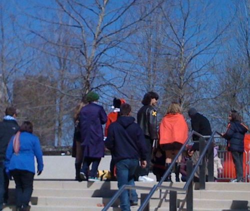 In view: The Joker, Harley Quinn, Wolverine, and Power Girl. Not visible: Black Canary, Jean Grey, and unknown female metahuman.